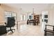 Open-concept living room area with dining area and tile floors at 7404 Eggshell Dr, North Las Vegas, NV 89084