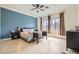 Bright main bedroom featuring a large window and a ceiling fan at 7404 Eggshell Dr, North Las Vegas, NV 89084