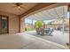 Covered patio area with dining table and chairs, perfect for outdoor entertaining and relaxation at 7404 Eggshell Dr, North Las Vegas, NV 89084