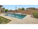 Beautiful pool area with a spa and well-maintained landscaping, perfect for summer relaxation at 7404 Eggshell Dr, North Las Vegas, NV 89084