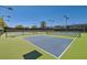 Well-maintained tennis court with professional surfacing and lighting, perfect for recreational play and exercise at 7404 Eggshell Dr, North Las Vegas, NV 89084