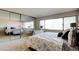 Bedroom with a large closet, natural lighting, and seating area at 745 N Royal Crest Cir # 127, Las Vegas, NV 89169