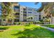 Multi-story condo building featuring balconies and landscaping at 745 N Royal Crest Cir # 127, Las Vegas, NV 89169