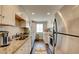 Kitchen with stainless steel appliances, granite countertops, and white cabinets at 745 N Royal Crest Cir # 127, Las Vegas, NV 89169