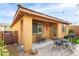 Outdoor living space with an outdoor seating area, patio, bench, overhead lighting and desert landscaping at 7611 Redcloud Peak St St, Las Vegas, NV 89166