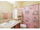 Bathroom featuring a pink Hello Kitty shower curtain, vanity, and mirror at 7611 Redcloud Peak St St, Las Vegas, NV 89166