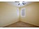 Bedroom featuring carpet, plantation shutters and a ceiling fan at 7611 Redcloud Peak St St, Las Vegas, NV 89166