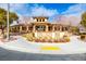 Beautiful clubhouse exterior featuring desert landscaping, decorative stone accents, and well-manicured grounds at 7611 Redcloud Peak St St, Las Vegas, NV 89166