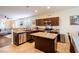 Modern kitchen with stainless appliances, granite countertops, and dark wood cabinetry at 7611 Redcloud Peak St St, Las Vegas, NV 89166