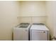 Laundry room featuring a front load washer and dryer and a wire shelf at 7611 Redcloud Peak St St, Las Vegas, NV 89166