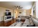 Inviting living room featuring hardwood floors, comfortable seating, and modern decor at 7611 Redcloud Peak St St, Las Vegas, NV 89166