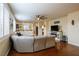Open living room with hardwood floors, ceiling fan, and ample natural light at 7611 Redcloud Peak St St, Las Vegas, NV 89166