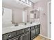 Functional bathroom featuring a double sink vanity, neutral tones, and plenty of counter space at 7624 Mallard Bay Ave, Las Vegas, NV 89179
