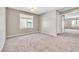 Spacious bedroom features neutral carpet, a window and en suite bathroom at 7624 Mallard Bay Ave, Las Vegas, NV 89179