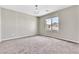 Bright and airy empty room featuring neutral paint, and plush carpeting ready for your personal design at 7624 Mallard Bay Ave, Las Vegas, NV 89179