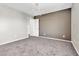 Bright and airy empty room featuring neutral paint, and plush carpeting ready for your personal design at 7624 Mallard Bay Ave, Las Vegas, NV 89179