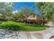 Inviting home exterior featuring a lush lawn, charming landscaping, and a paved walkway at 7624 Mallard Bay Ave, Las Vegas, NV 89179