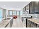 Well-equipped kitchen features granite counters, tile backsplash, and stainless steel appliances at 7624 Mallard Bay Ave, Las Vegas, NV 89179