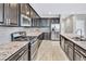 Well-equipped kitchen with stainless steel appliances, granite countertops, and sleek cabinetry at 7624 Mallard Bay Ave, Las Vegas, NV 89179