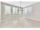 The living room has light wood flooring and lots of natural light at 7624 Mallard Bay Ave, Las Vegas, NV 89179