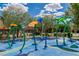 Community water play area with colorful sprayers and benches for relaxing on a sunny day at 7624 Mallard Bay Ave, Las Vegas, NV 89179