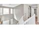 Bright staircase with white railing and carpeted steps at 7624 Mallard Bay Ave, Las Vegas, NV 89179
