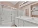 This bathroom includes a double sink vanity, shower-tub combo, and a well-lit vanity at 8012 Desire Ave, Las Vegas, NV 89128