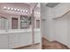Bathroom with dual sinks, large mirrors, and access to a large walk-in closet at 8012 Desire Ave, Las Vegas, NV 89128