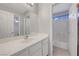 Bathroom features a large vanity, an open view of the bathroom and a connecting door to the bedroom at 8012 Desire Ave, Las Vegas, NV 89128