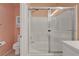 Updated bathroom featuring a shower-tub with glass doors at 8012 Desire Ave, Las Vegas, NV 89128