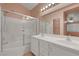 Bathroom featuring a double vanity and a glass enclosed tub-shower at 8012 Desire Ave, Las Vegas, NV 89128
