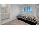 Comfortable bedroom features a window with natural light and is conveniently connected to the bathroom at 8012 Desire Ave, Las Vegas, NV 89128