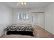 Well-lit bedroom with mirrored closet doors, a ceiling fan, and a window with shutters at 8012 Desire Ave, Las Vegas, NV 89128