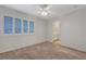 Bedroom with a ceiling fan, carpet, and window with shutters at 8012 Desire Ave, Las Vegas, NV 89128