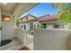 View from the front porch showcasing the entry gate and the home's facade at 8012 Desire Ave, Las Vegas, NV 89128