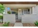 Charming front porch featuring a gated entrance with desert-style landscaping at 8012 Desire Ave, Las Vegas, NV 89128