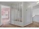 Hallway with decorative mirrors, neutral carpeting, and access to upstairs bedrooms at 8012 Desire Ave, Las Vegas, NV 89128