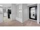 Hallway features stylish mirrored wall and access to kitchen and dining area, creating an open flow at 8012 Desire Ave, Las Vegas, NV 89128