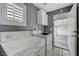 Well-lit laundry room with modern washer and dryer plus access to the garage at 8012 Desire Ave, Las Vegas, NV 89128