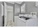 Laundry room with modern washer and dryer, next to a storage area at 8012 Desire Ave, Las Vegas, NV 89128