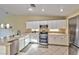 Modern kitchen featuring white cabinets, stainless steel appliances, and ample counter space at 8212 Cabin Springs Ave, Las Vegas, NV 89131