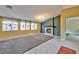 Spacious living room featuring a fireplace, tiled floor, and many windows with bright natural light at 8212 Cabin Springs Ave, Las Vegas, NV 89131