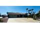 Single-story home featuring a three-car garage, desert landscaping, and stone accents at 8225 Fulton Ranch St, Las Vegas, NV 89131