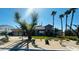 Charming single-story home with desert landscaping, palm trees, and a stone entryway at 8225 Fulton Ranch St, Las Vegas, NV 89131