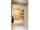 Bright hallway featuring wood floors, a recessed art niche, and a double front door at 8225 Fulton Ranch St, Las Vegas, NV 89131