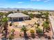 Backyard featuring mature palm trees and rock landscaping, and a desert landscape at 8536 Grand Palms Cir, Las Vegas, NV 89131
