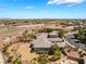 Desert home featuring a massive backyard with mature palms and rock landscaping at 8536 Grand Palms Cir, Las Vegas, NV 89131