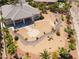 Backyard featuring mature palm trees and decorative rock, hardscape and landscaping at 8536 Grand Palms Cir, Las Vegas, NV 89131