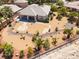 Backyard featuring mature palm trees and a rock design, hardscape, fence at 8536 Grand Palms Cir, Las Vegas, NV 89131