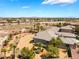 Expansive desert home with a huge backyard featuring mature palm trees and an in-ground pool at 8536 Grand Palms Cir, Las Vegas, NV 89131